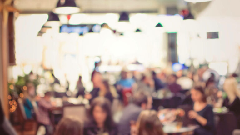 Busy restaurant with a blurred effect.